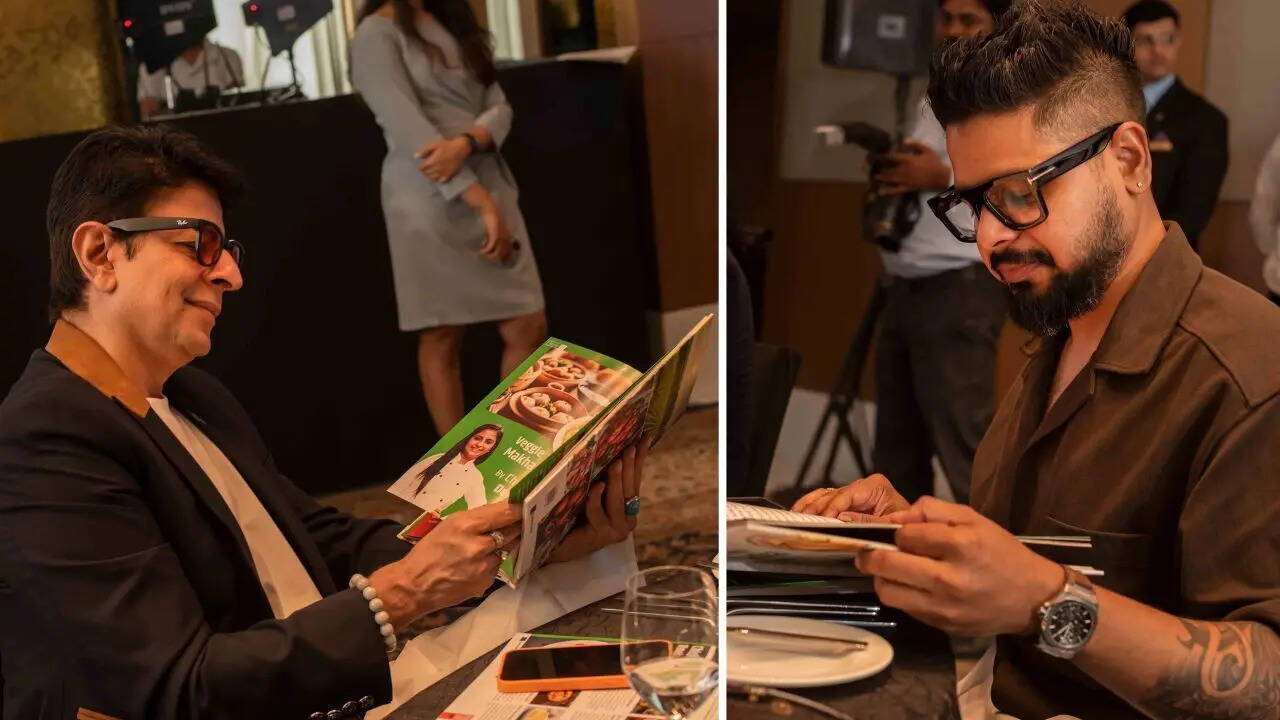 Amit Lohani, Founder and Director of Forum of Indian Food Importers (FIFI) and Chef Sougata Ghosh seen going through the book that was launched at the event, titled A Taste Of Home With EU Tadka