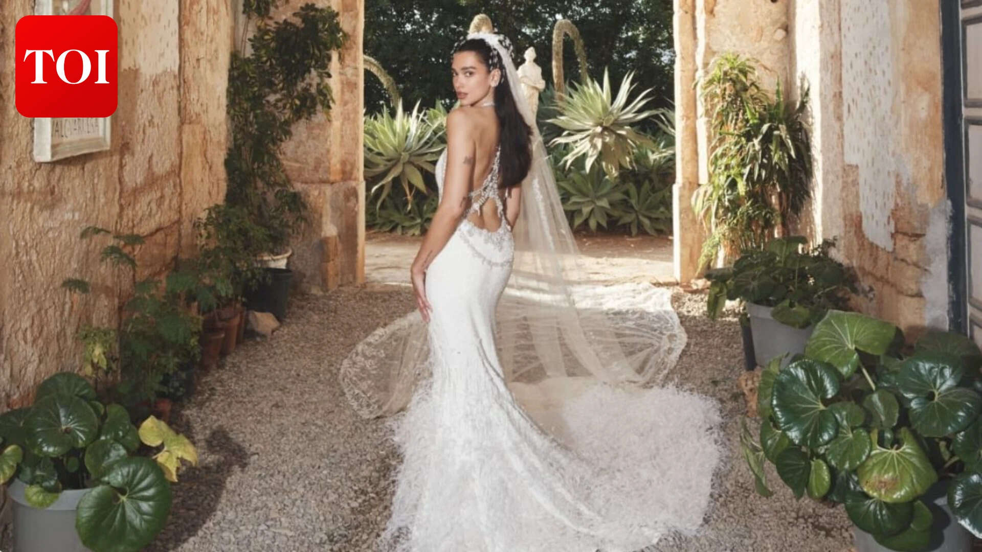 Dua Lipa in custom Chanel haute couture wedding gown