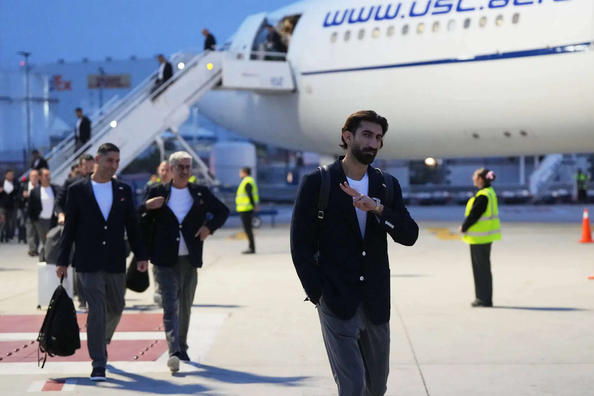 Iran goalkeeper Alireza Beiranvand gestures as he arrives with his teammates for the World Cup soccer tournament in Tijuana, Mexico, Sunday, June 7, 2026. (AP Photo/Gregory Bull) Iran WCup Soccer