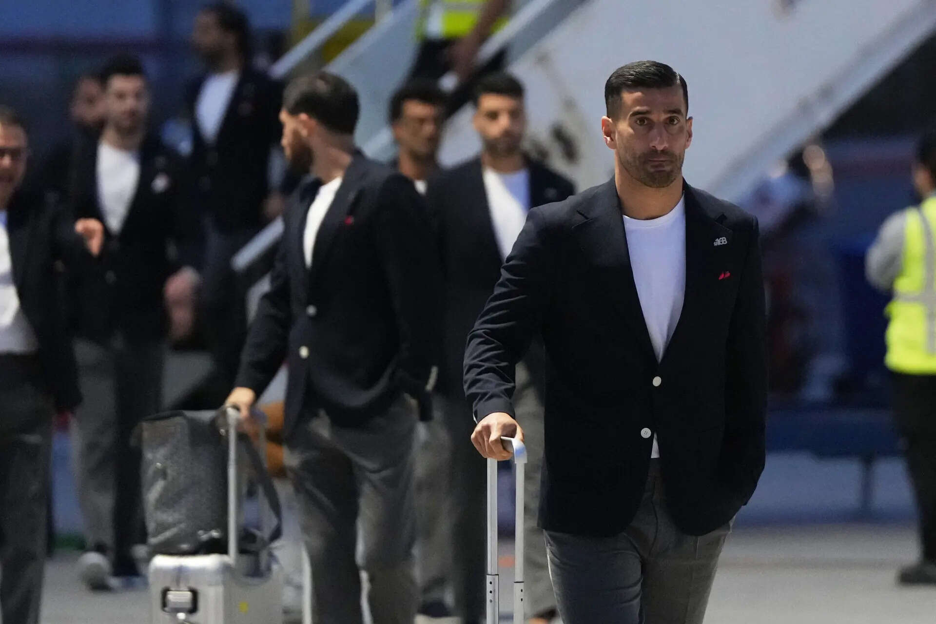 Iran's Ehsan Hajisafi, right, arrives with his teammates for the World Cup soccer tournament in Tijuana, Mexico, Sunday, June 7, 2026. (AP Photo/Gregory Bull) Iran’s soccer team arrives in Mexico for training ahead of the World Cup