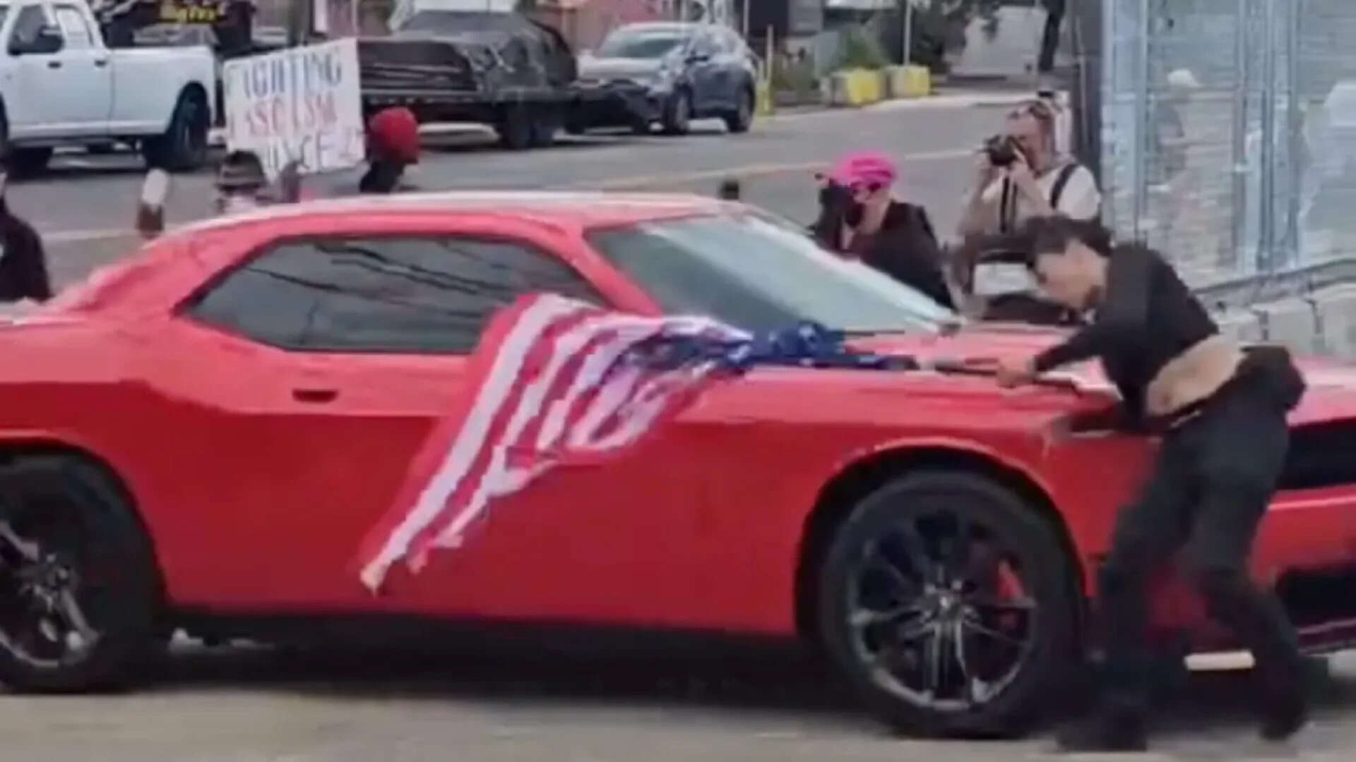Anti-ICE protester waving upside-down US flag hit by car in New Jersey: Video