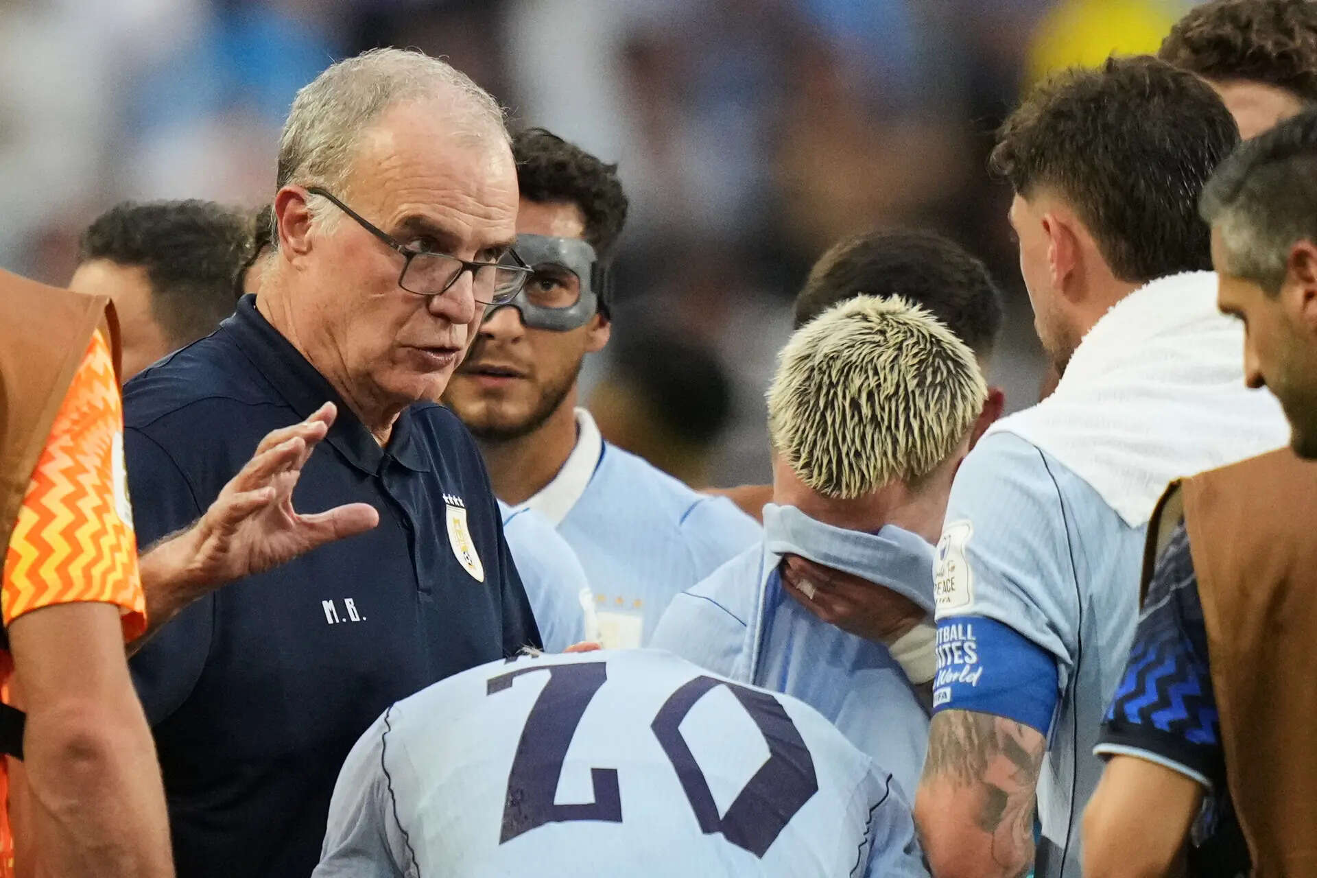 Uruguay head coach Marcelo Bielsa talks to his players during a hydration break in a World Cup Group H match against Saudi Arabia in Miami Gardens, Florida. (AP) FIFA hydration breaks spark backlash and blamed for killing momentum at World Cup