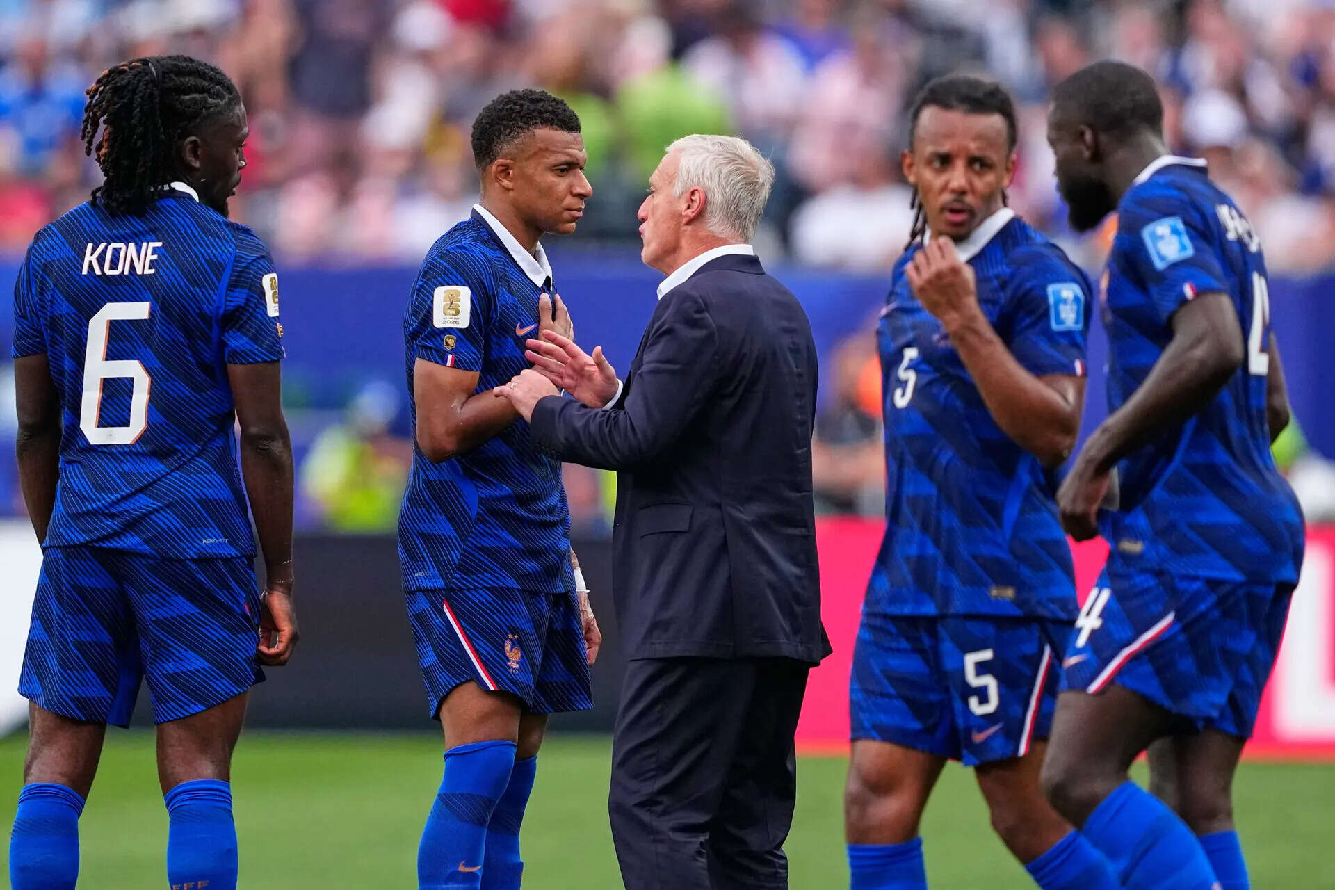 France head coach Didier Deschamps talks with Kylian Mbappe (10) in the hydration break during the World Cup match against Iraq in Philadelphia. (AP) Iraq France WCup Soccer