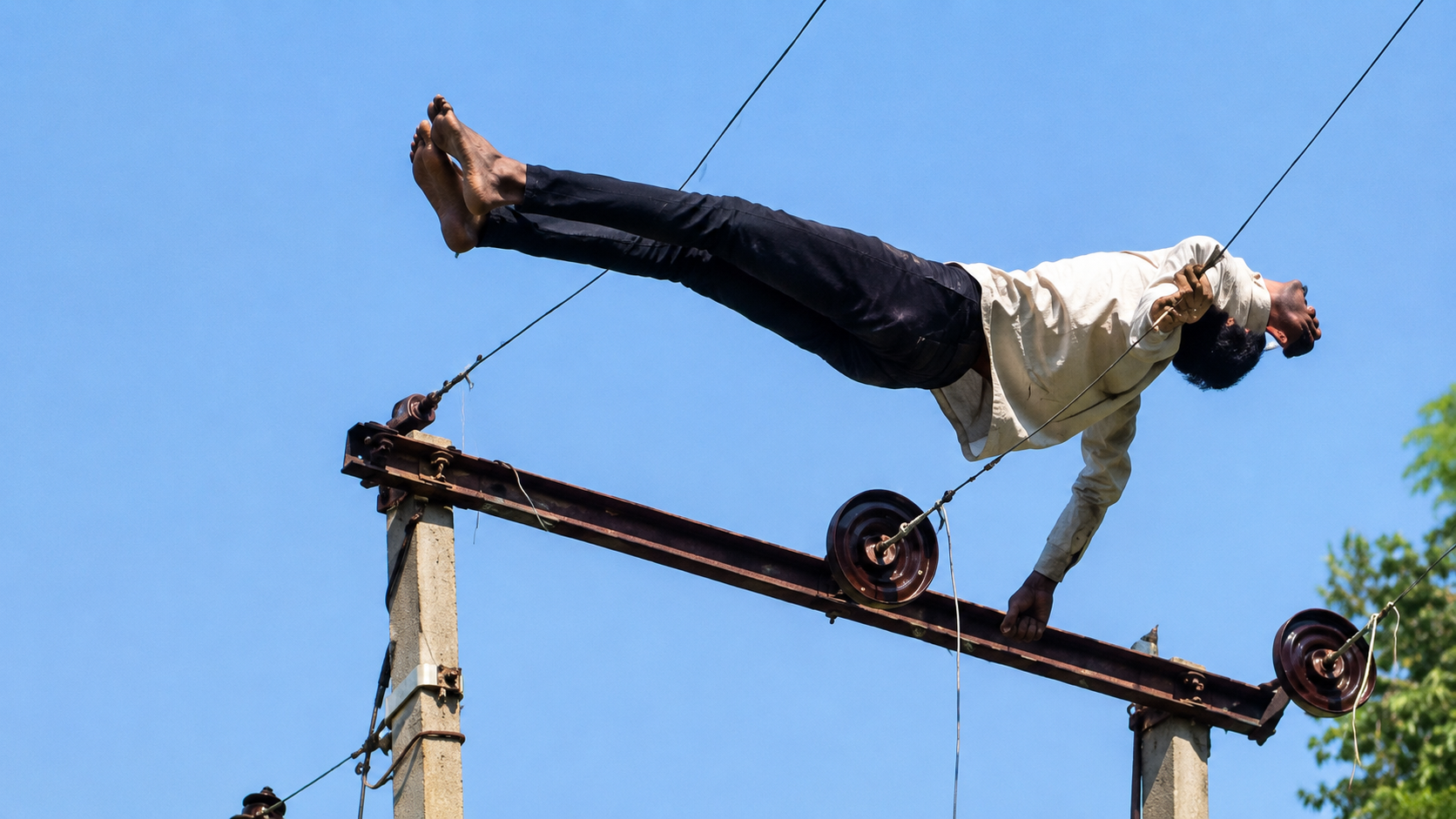Watch: Drunk man climbs 11,000-volt pole, power supply shut for rescue