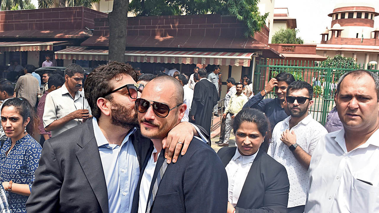  Keshav Suri and his husband, Cyril Feuillebois, celebrate the reading down of Section 377 with a kiss outside the Supreme Court. The landmark judgment decriminalised consensual same-sex relations between adults in India