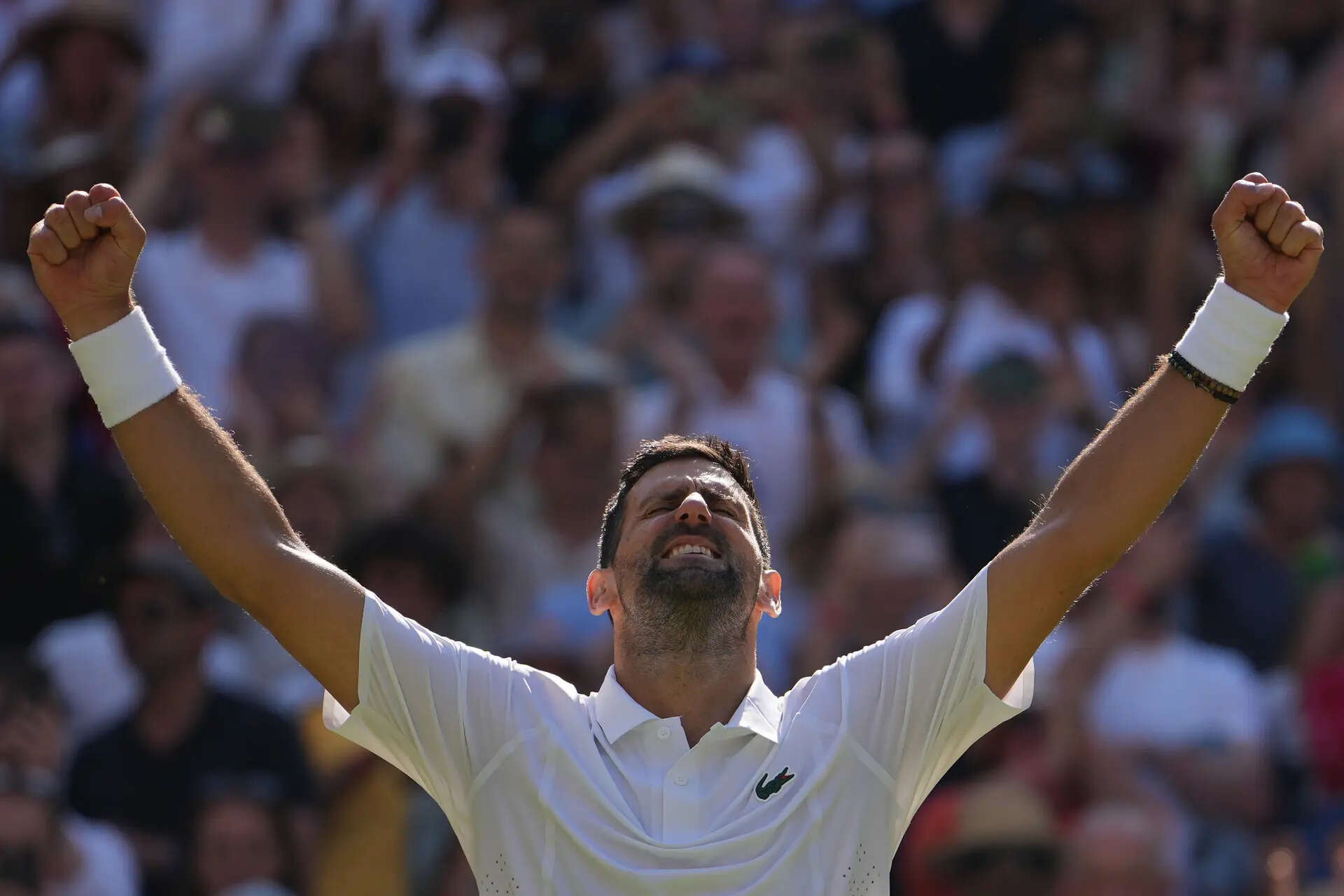 Novak Djokovic of Serbia celebrates his victory against Arthur Rinderknech of France in their third round men's singles match at the Wimbledon Tennis Championships in London, Friday, July 3, 2026. (AP Photo/Kin Cheung) Novak Djokovic earns 105th match win at Wimbledon to equal Roger Federer record