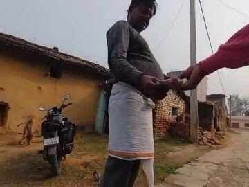 0dd53775-38cf-4f7d-8ac6-a3812eeaac6e_A_photo_captured_from_the_viral_video_showing_mukhiya_taking_bribe_from_a_worker.jpg