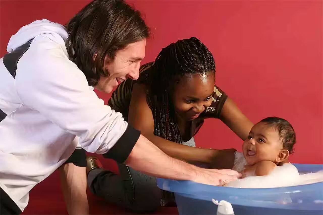 Lionel Messi with a baby named Lamine Yamal