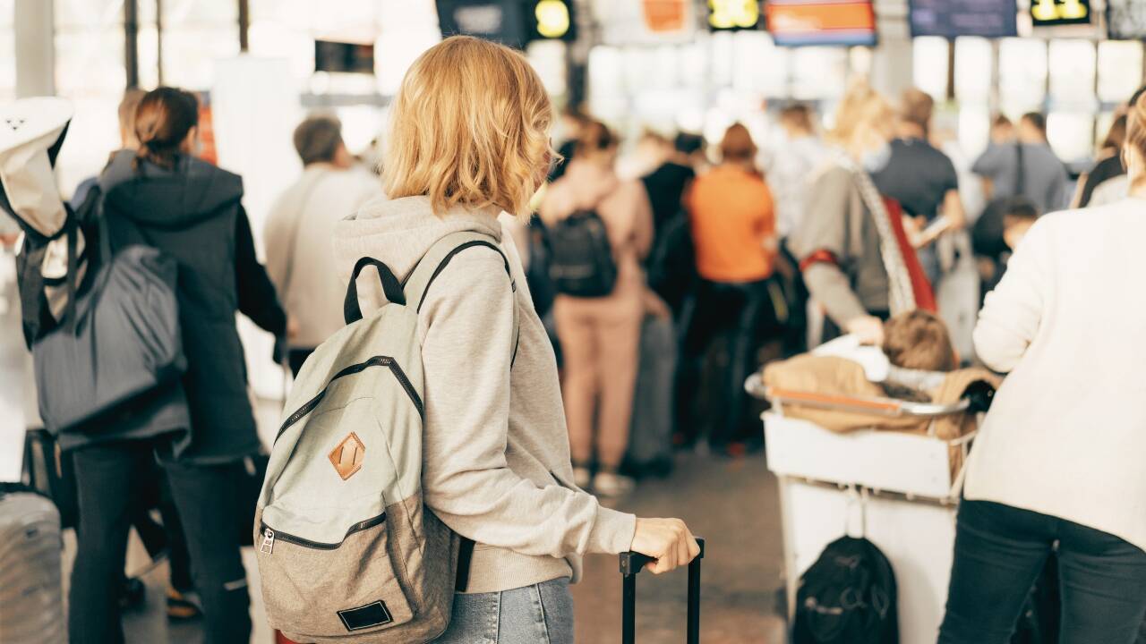 Travellers in a busy airport