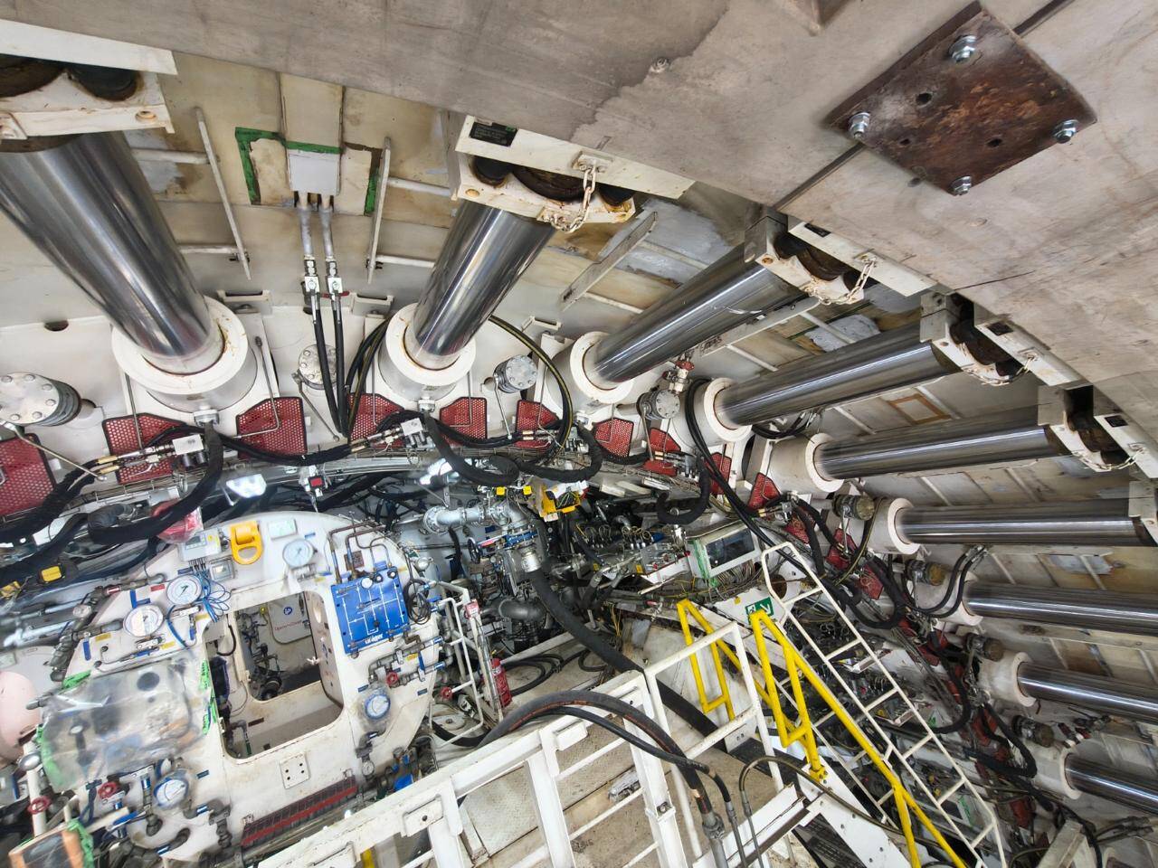 The shaft area is equipped with multiple support systems essential for TBM operations