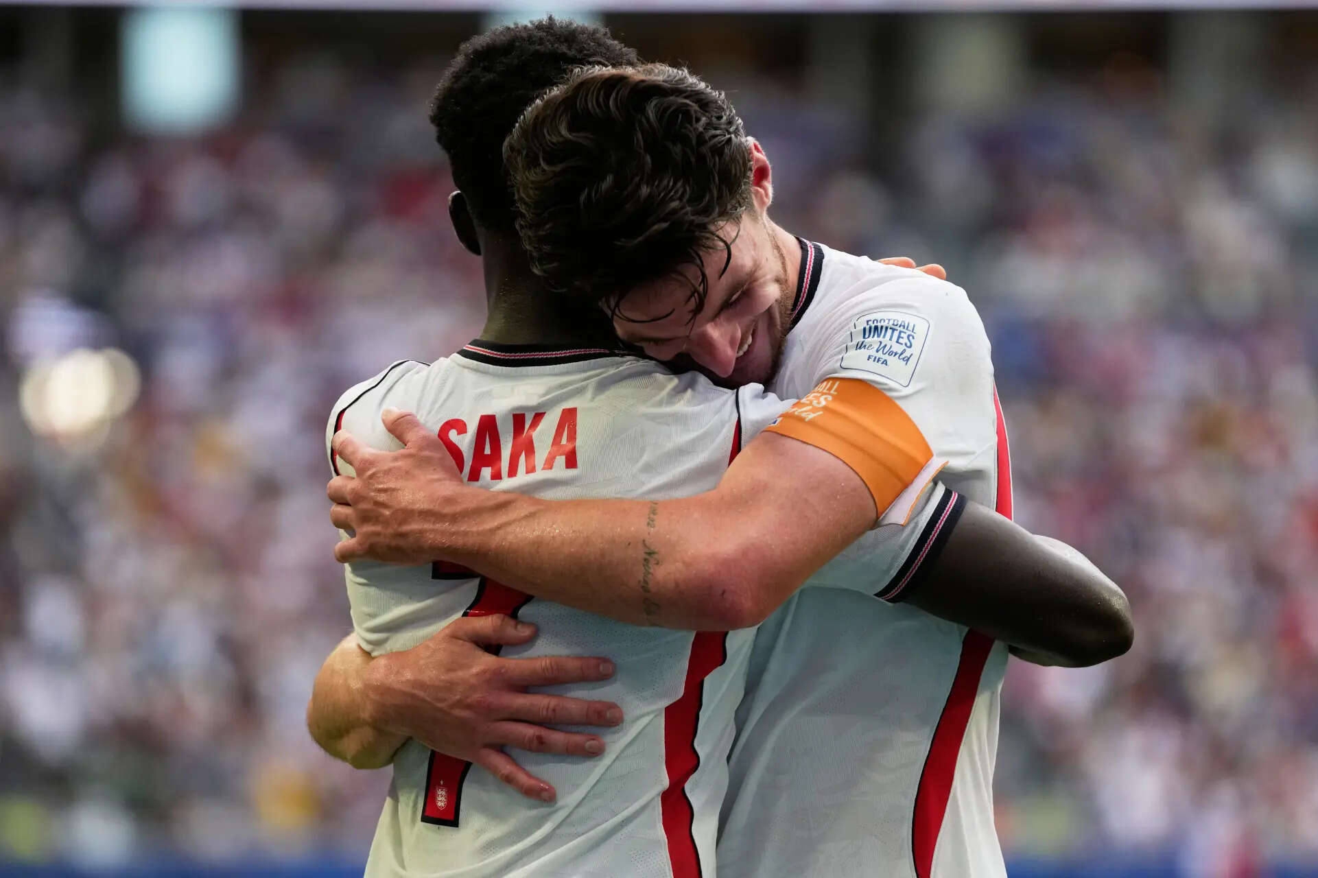 England's Declan Rice, right, congrats Bukayo Saka (7) after scoring his third goal of the game from the penalty spot during the World Cup third-place playoff soccer match between France and England in Miami Gardens, Fla., Saturday, July 18, 2026. (AP Photo/Lynne Sladky) England France WCup Soccer