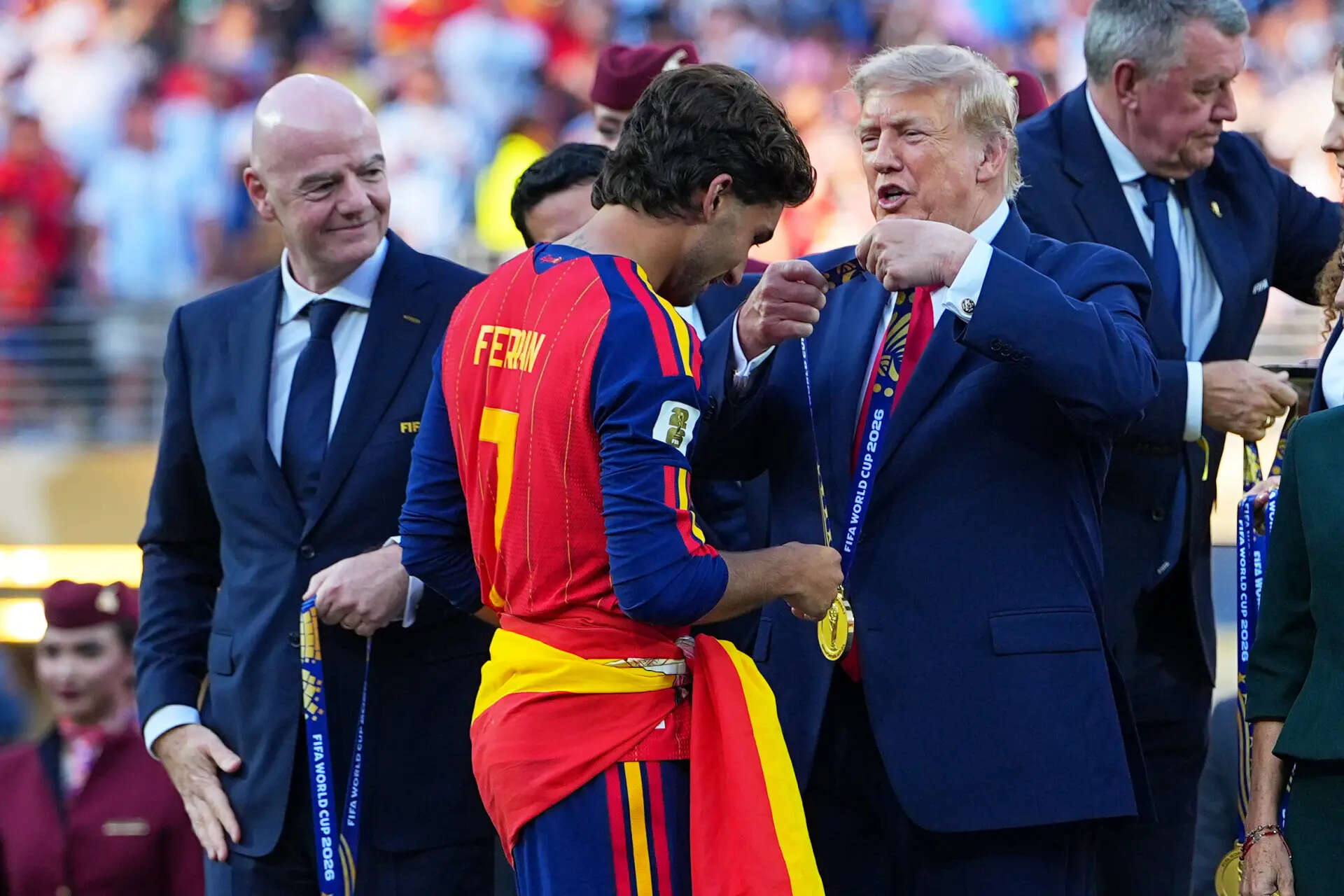 President Donald J. Trump gives Spain's Ferran Torres (7) winners metal during the World Cup final soccer match between Spain and Argentina in East Rutherford, N.J., near New York, Sunday, July 19, 2026. (AP Photo/Julio Cortez) Argentina Spain WCup Soccer
