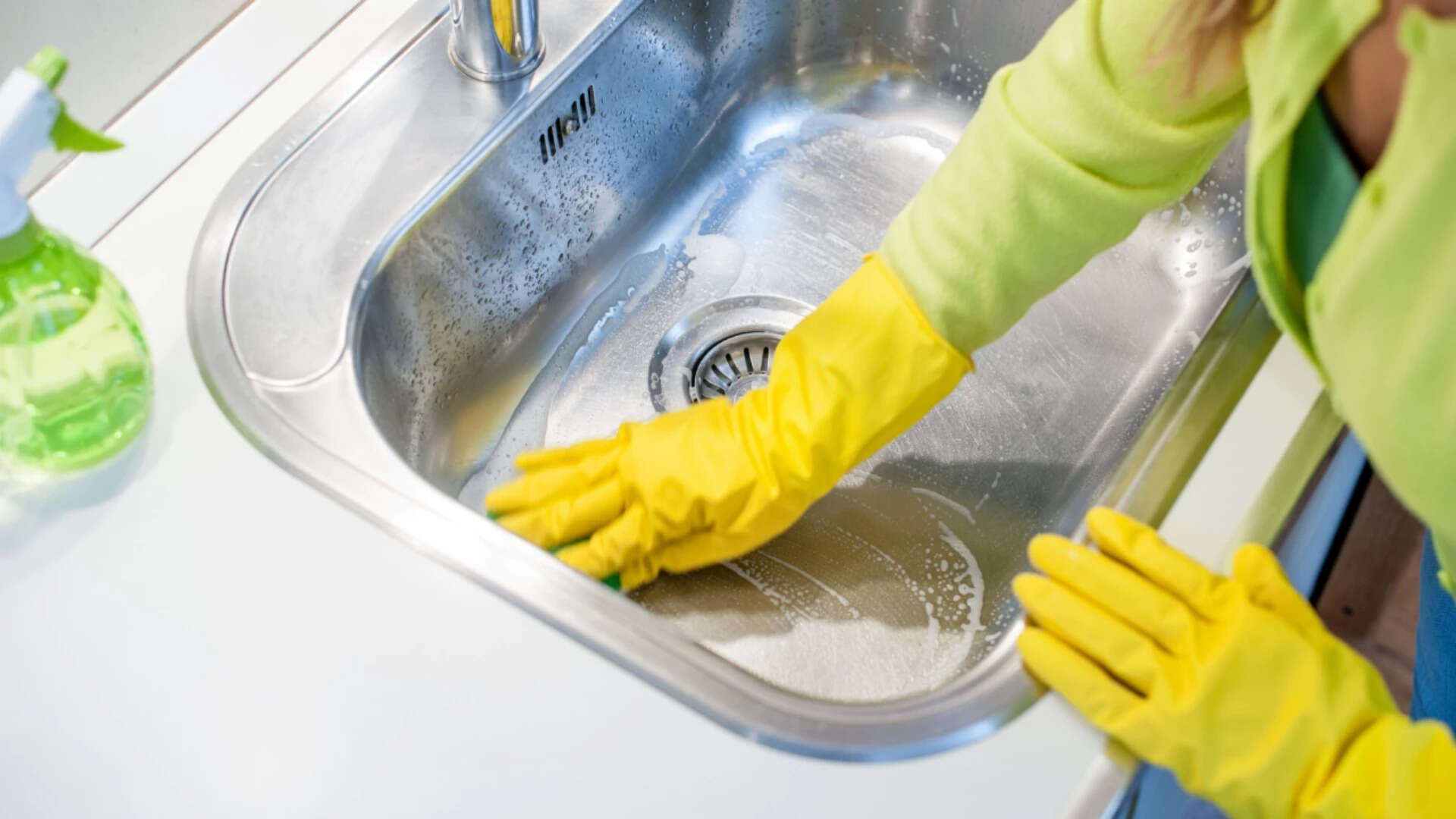 woman cleaning sink