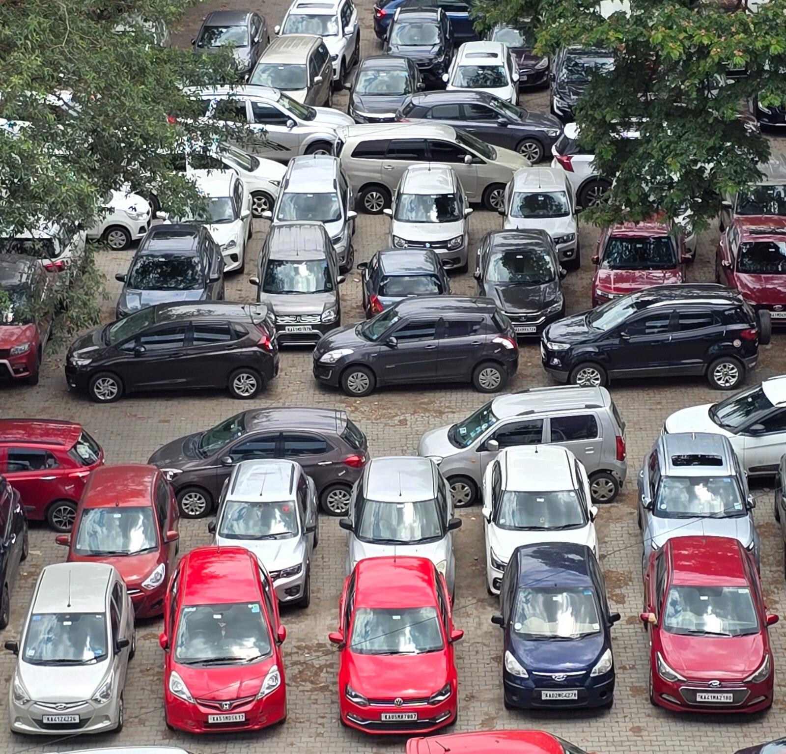 (Photo credit: TOI) Many cars are parked outside a metro station in Bengaluru