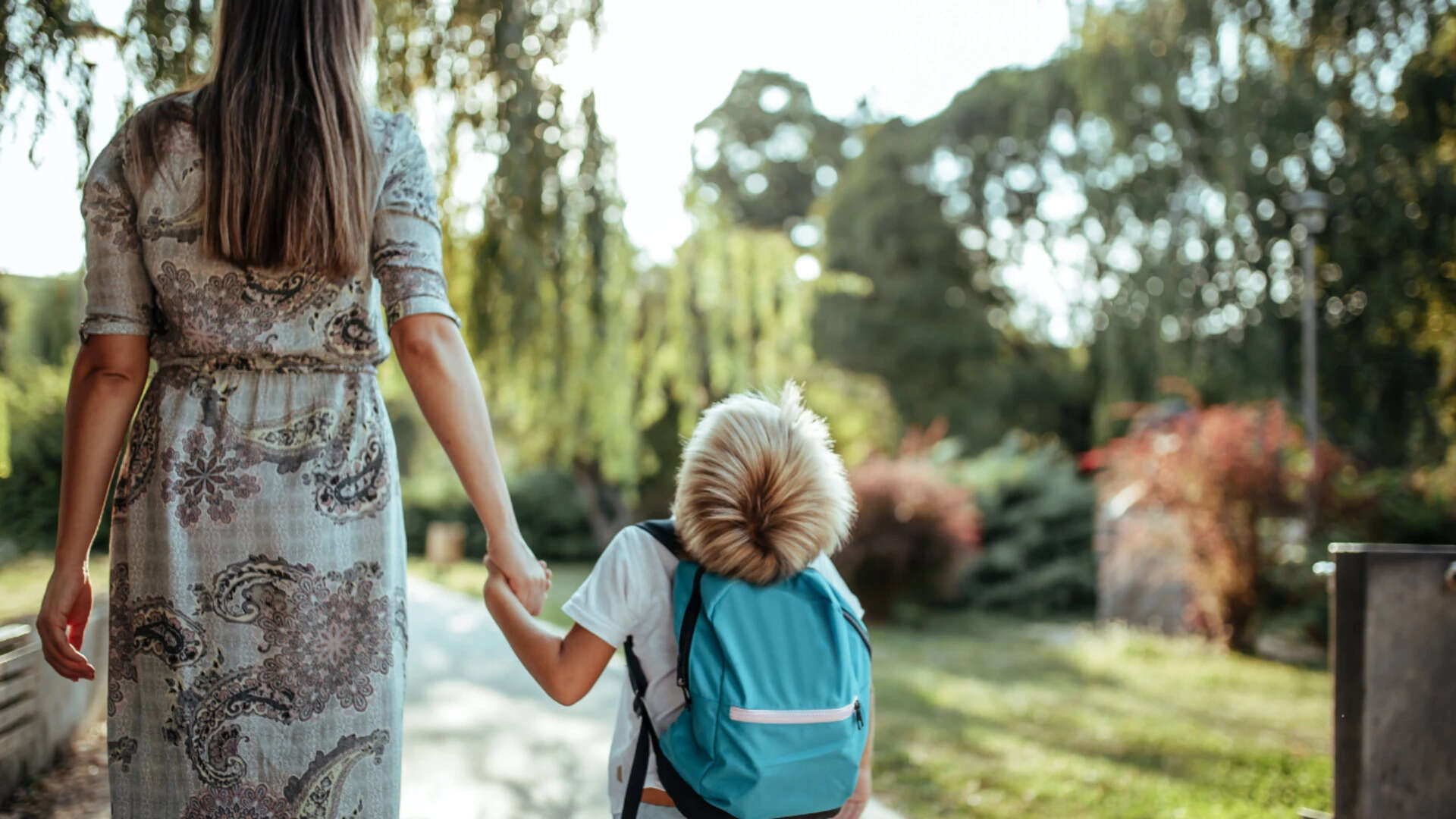 Kid walking with mother after school<br>