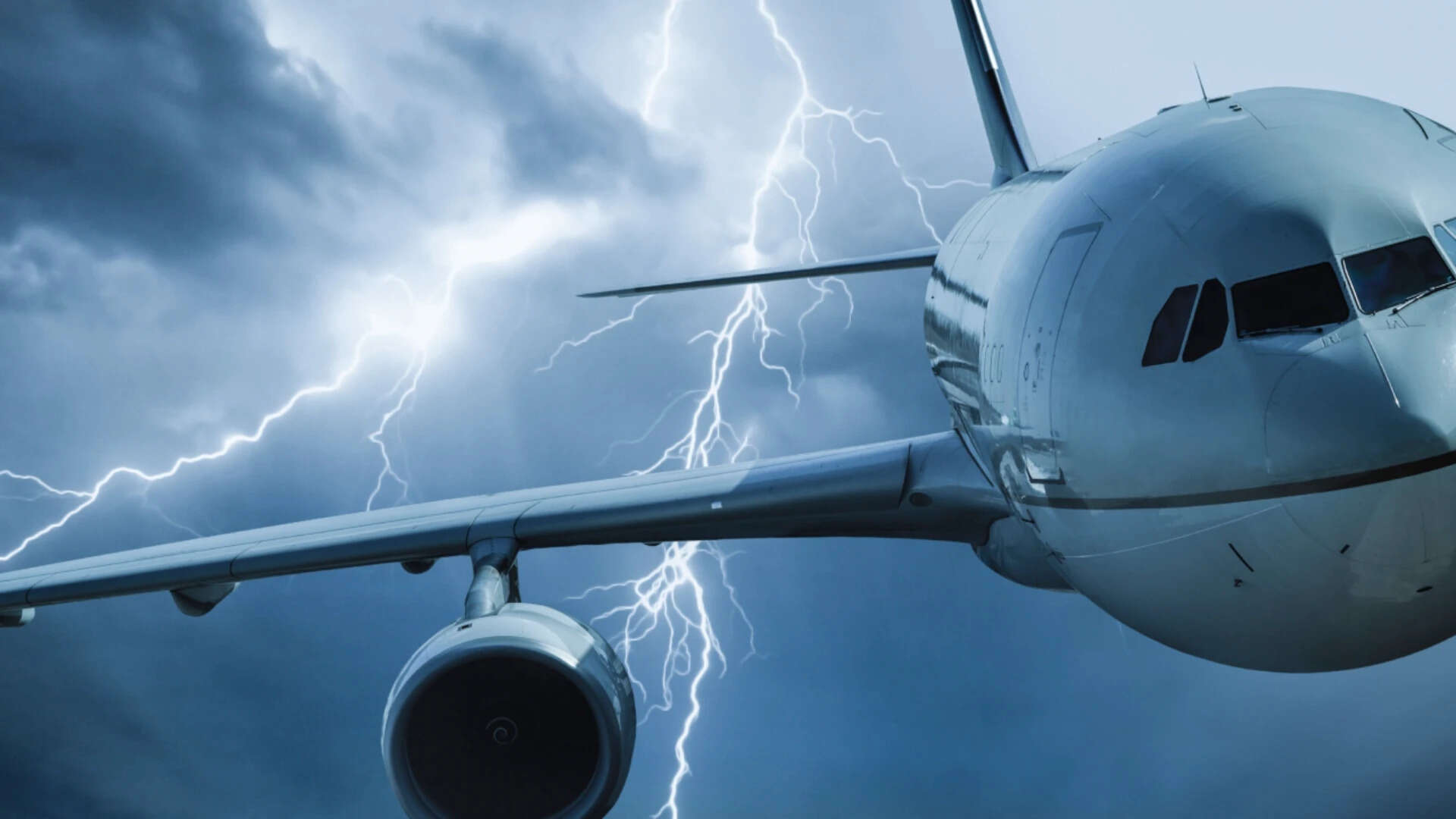 Jet travelling through stormy sky<br>