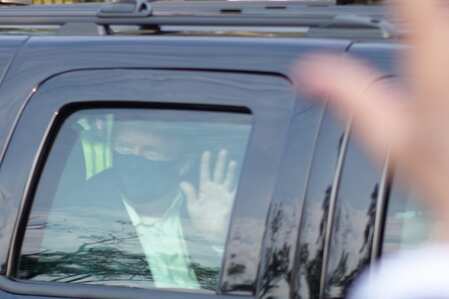 Bethesda:President Donald Trump drives past supporters gathered outside Walter R...