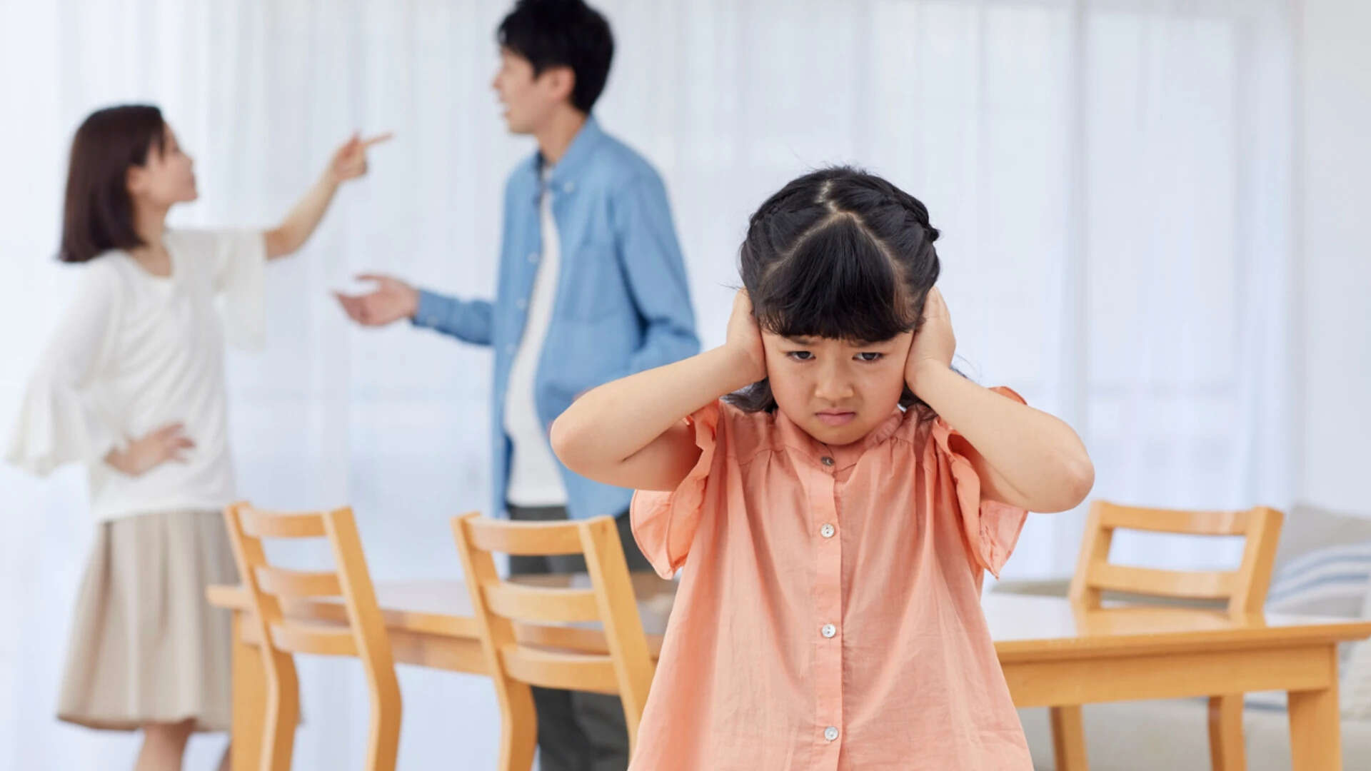 Upset Little Girl and Her Parents Fighting at Home<br>