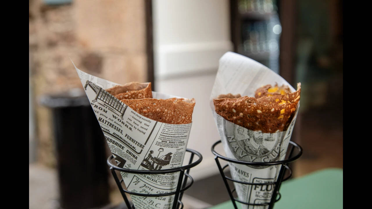 Food wrapped inside newspaper in a cafe