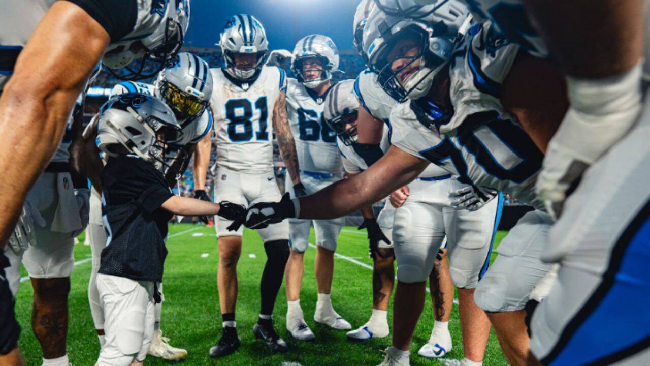 Asher Harvey with teammates<br>