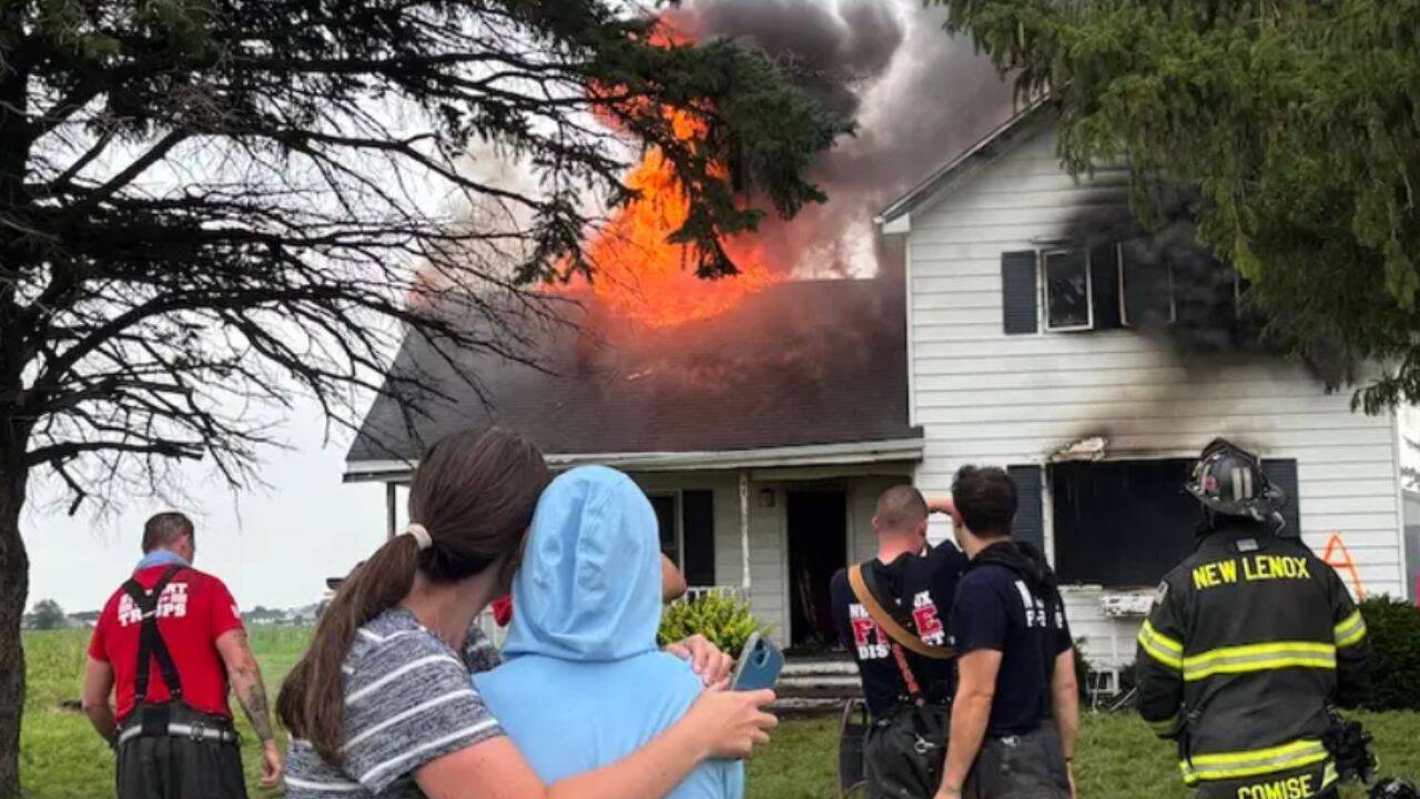 Meghan Keating (left) stands with her mother, Karen Kestel, as their family's four-generation farmhouse is burned