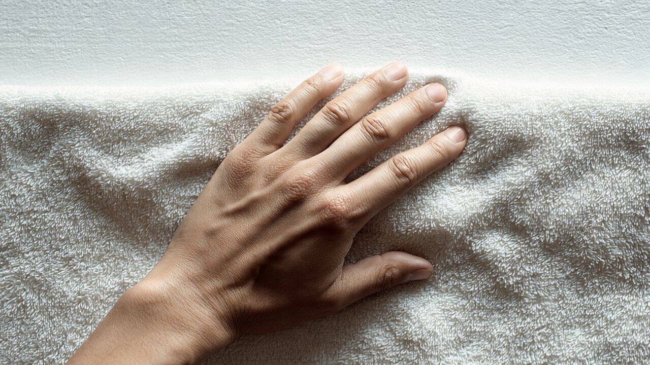 Press the fabric with a damp towel<br>