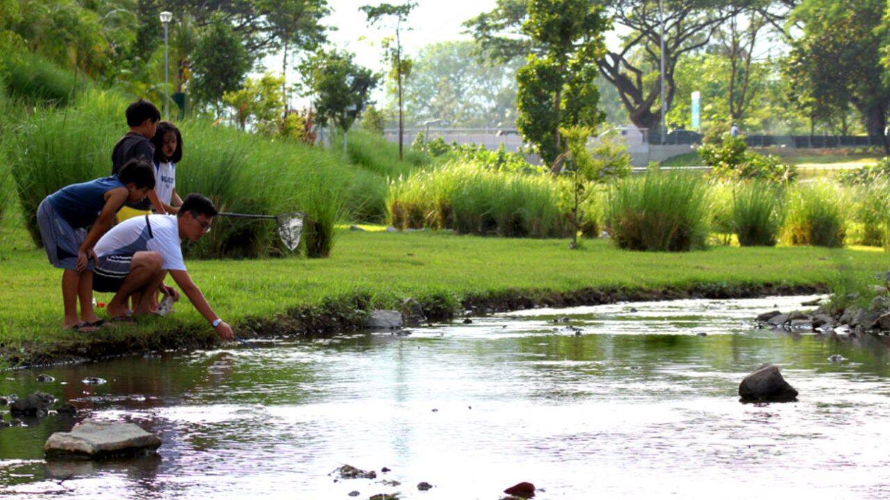 People fish at the rehabilitated waterway