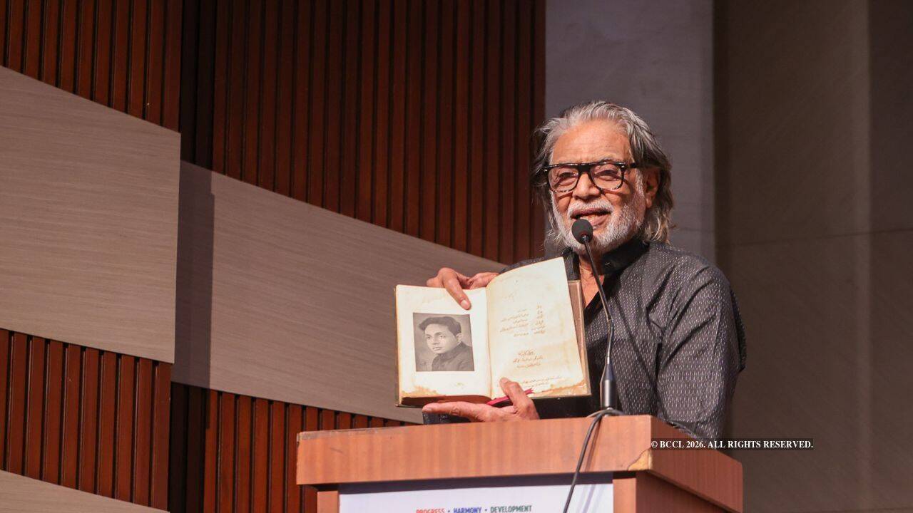 Muzaffar Ali with a book gifted to him by Rahi Masoom Raza<br>