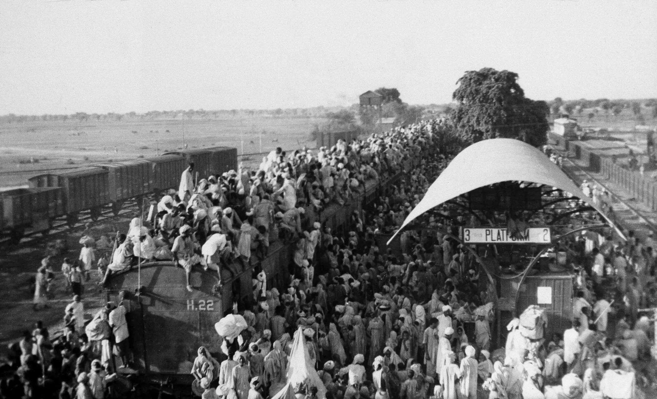 Refugees crowd onto a train