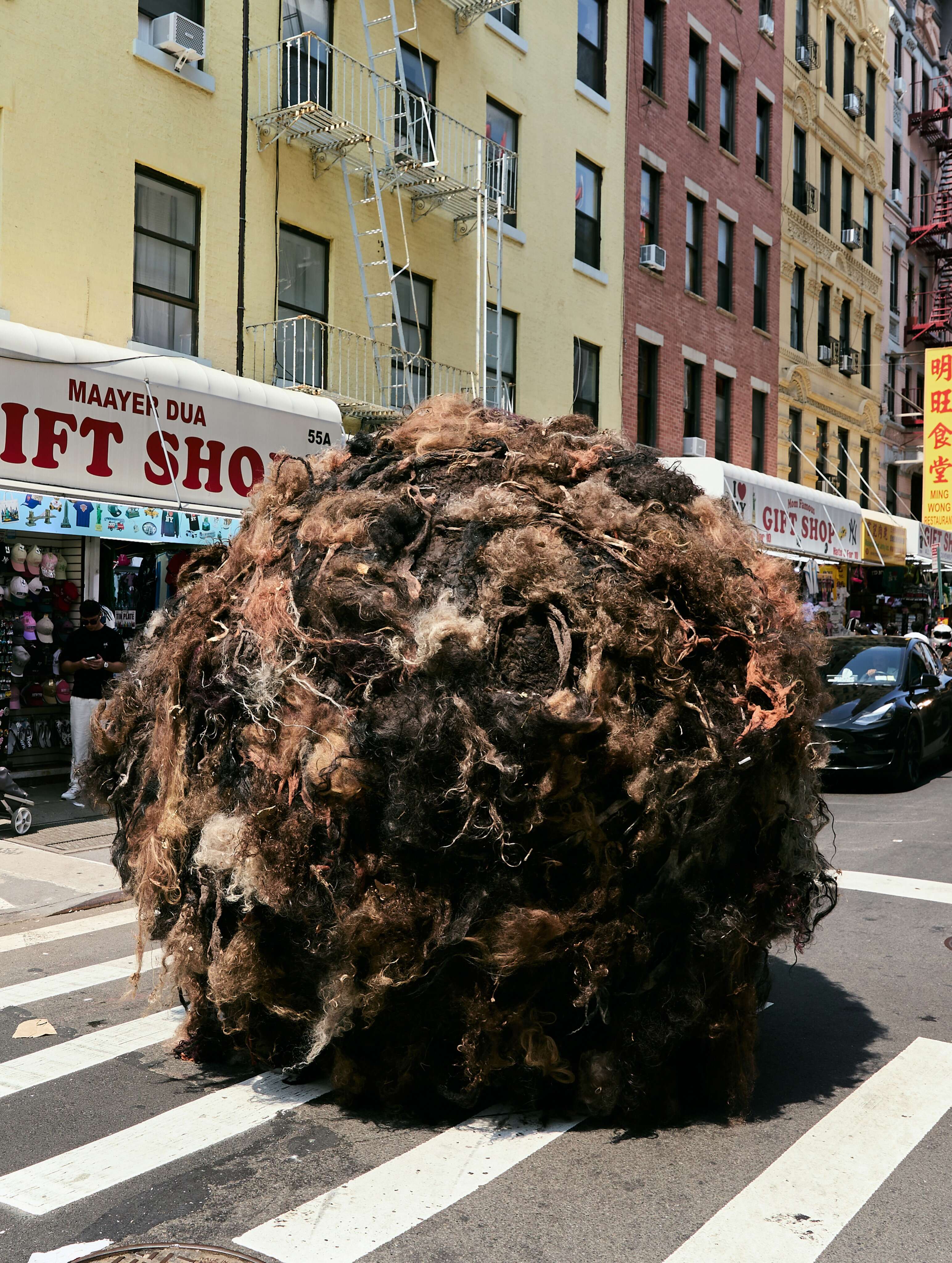 Instagram/ @uncommon.creative.studio Giant 10-foot ‘Tumblehair’ rolls through NYC streets