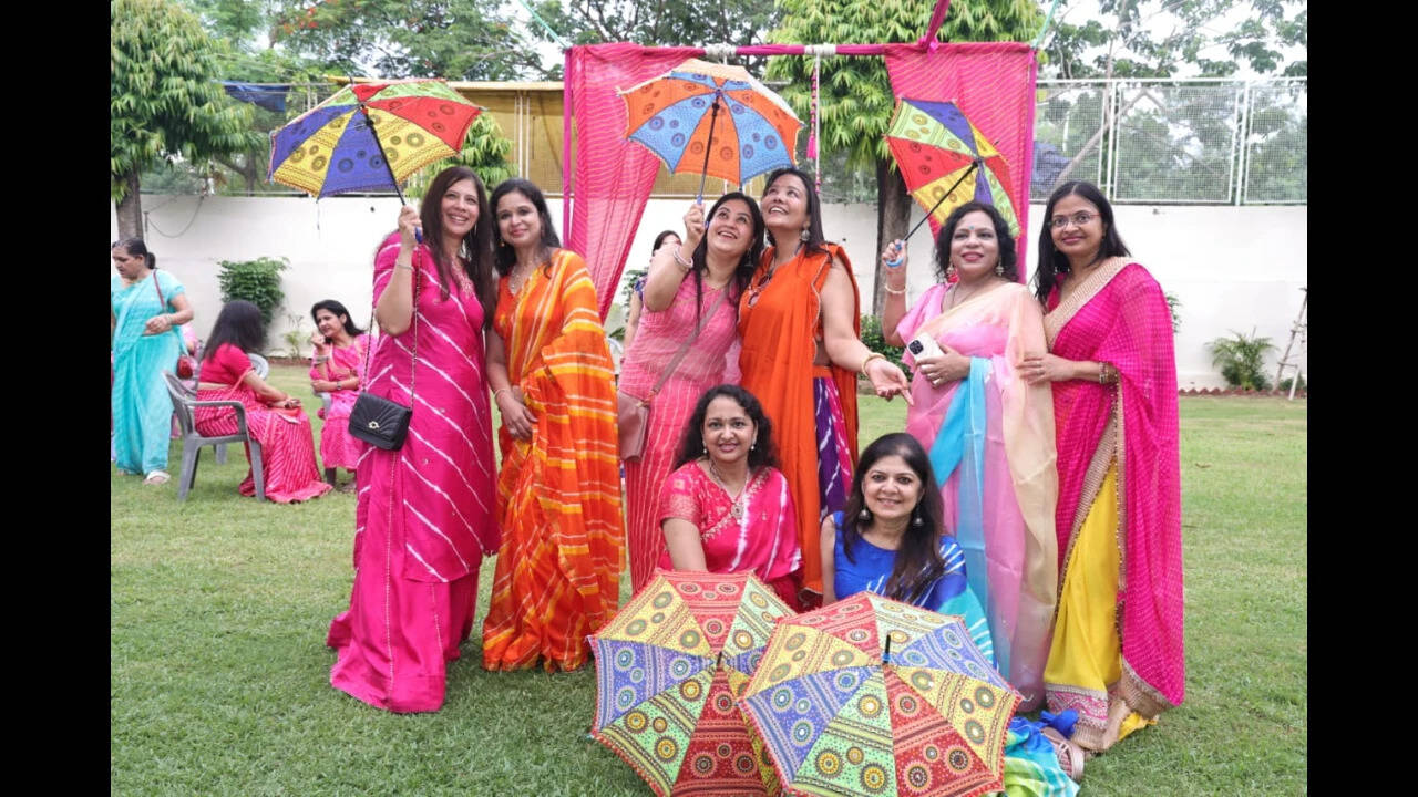 Doctors take part in festive celebrations with traditional attire and artwork