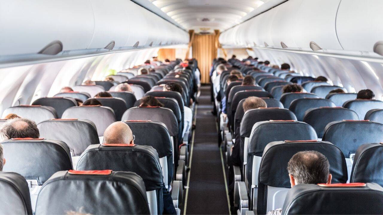 Elderly woman travelling with 10+ relatives turns quiet morning flight into a family reunion as breakfast
