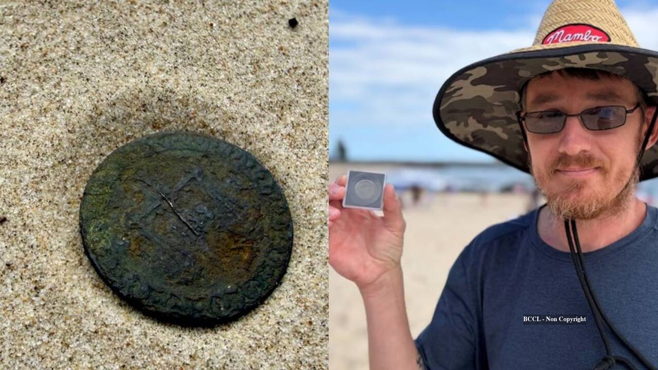 Metal detectorist stumbles on a 140-year-old Zanzibar coin while beachcombing in Australia