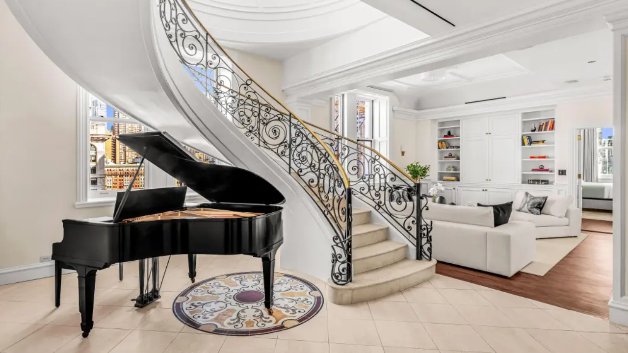 A gold-domed New York City penthouse first listed for $25 million has sold for $9 million