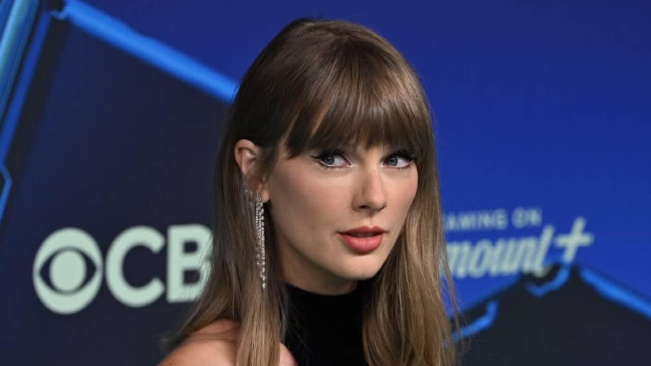 Taylor Swift attends MTV VMAs in 2026 in a black and silver floor-length dress