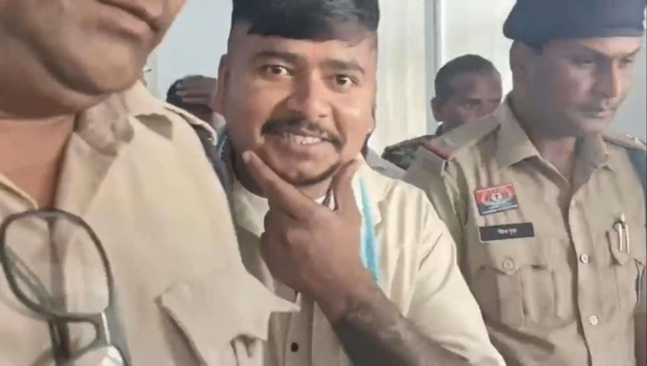 Chilling grin of man accused of killing cop’s wife, daughter outside court