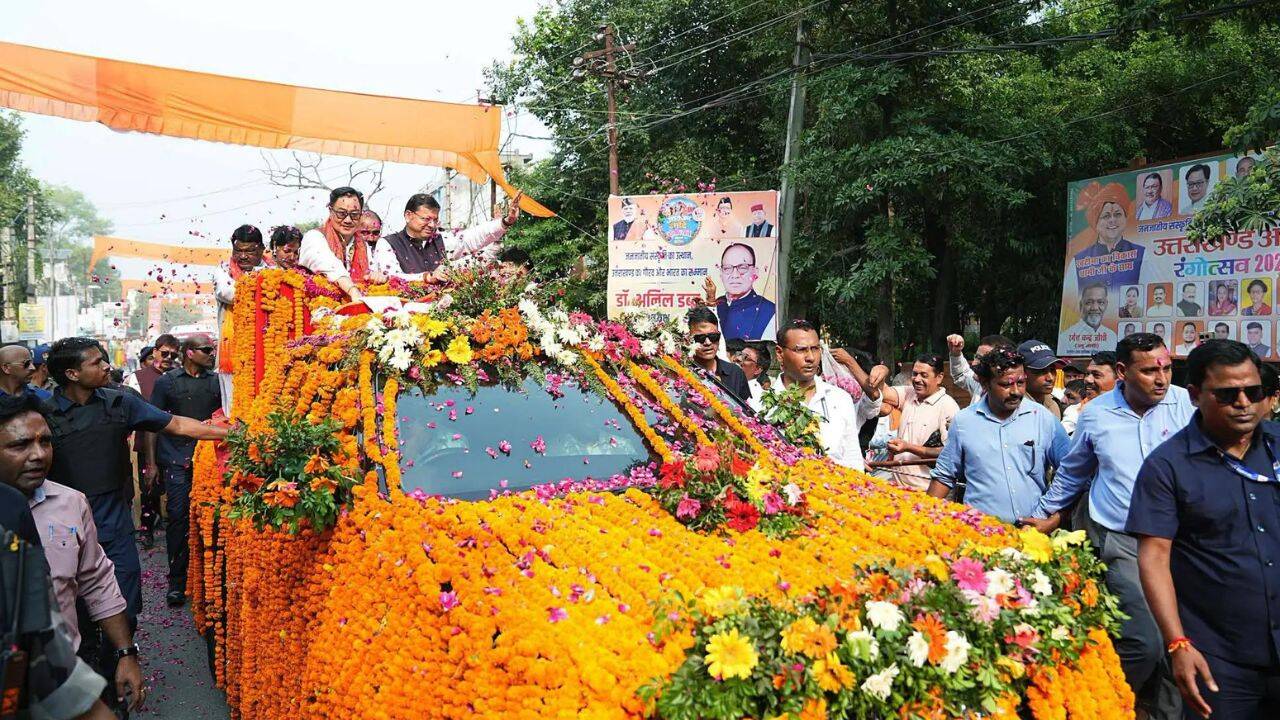 Uttarakhand CM Dhami, Union ministers Kiren Rijiju and Jual Oram lead massive roadshow, attend 'Aadi Rangotsav Festival' in Khatima