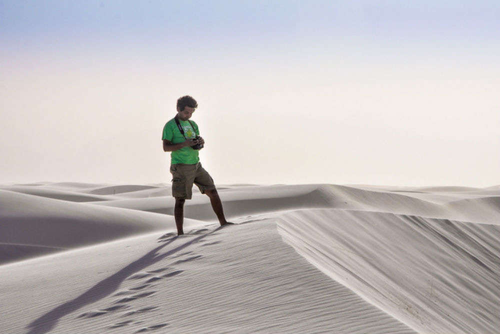 Going barefoot on dunes of white sand, hundreds of miles from any ocean