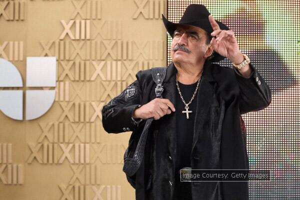Fans listening to Joan Sebastian's song about his son
