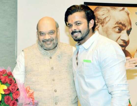 BJP President Amit Shah with Cricketer S Sreesanth during a meeting at Party's office in New Delhi on Friday. (PTI Photo)