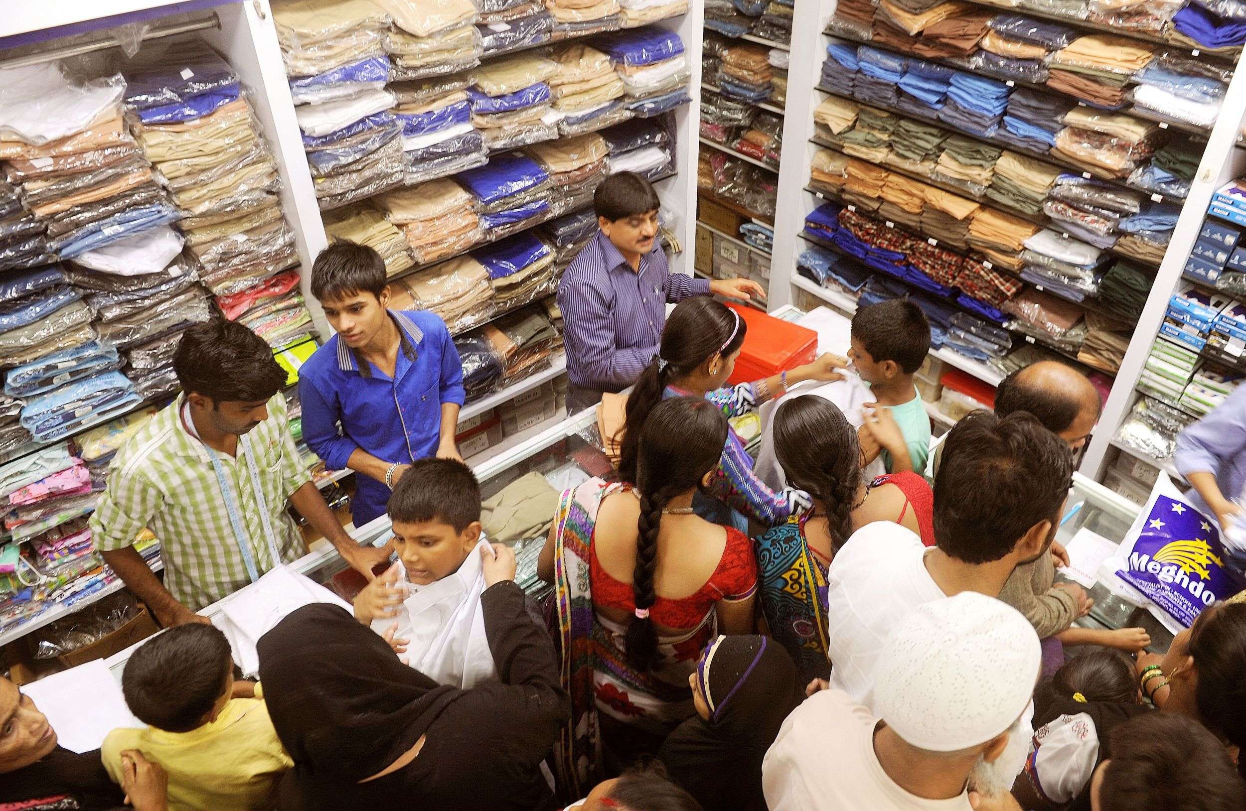 Shoppers at a store selling school uniforms and raincoats for children in Mumbai. (TOI file photo by Sanjay Hadkar)