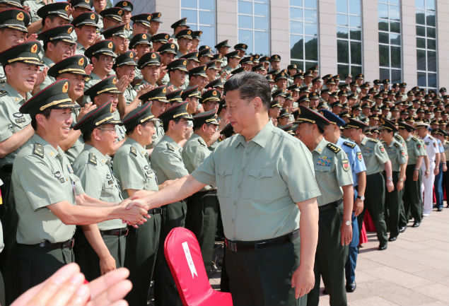 Chinese President Xi Jinping shakes hands with military delegates at a conference in Beijing. (AP photo)
