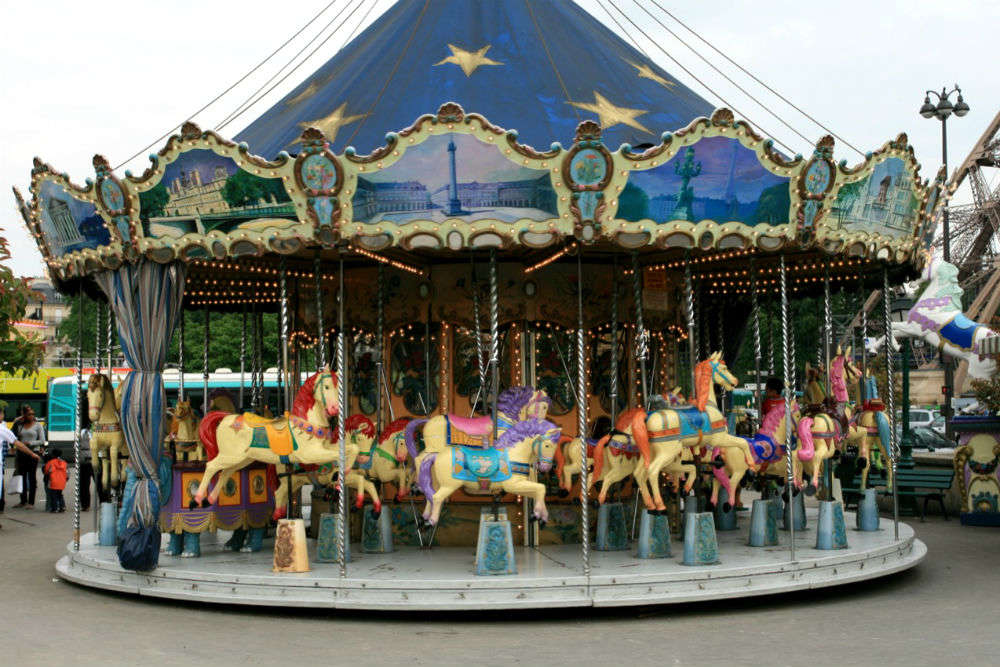 Let your kids ride one of the 20 free carousels around Paris