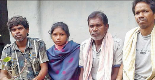 Soni, who fell into the river in Chhattisgarh, with her rescuers.