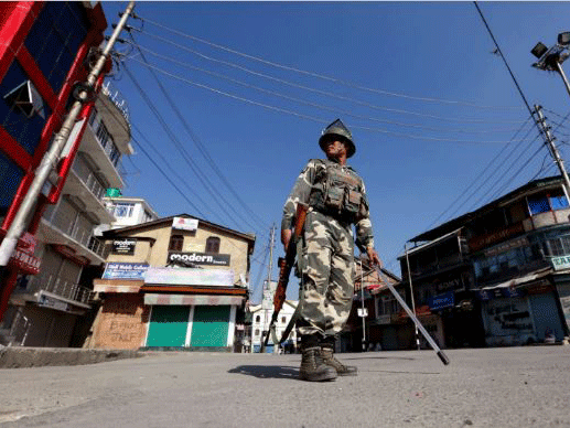 An Indian policeman stands guard in a deserted street during a curfew in Kashmir on Monday, 19th September, 2016. (Reuters Photo)