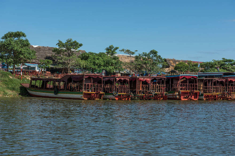 Take a boat ride to visit floating villages