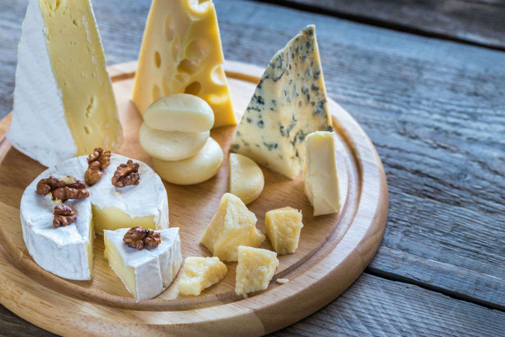 Visit a cheese cellar and learn about Swiss Cheese