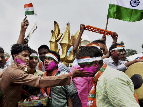 BJP activists celebrate the Indian army's Surgical strikes along the Line of Control in PoK, in Patna on Friday. (PTI Photo) 