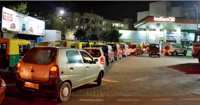 A long queue of cars outside a petrol pump in the city on Thursday.