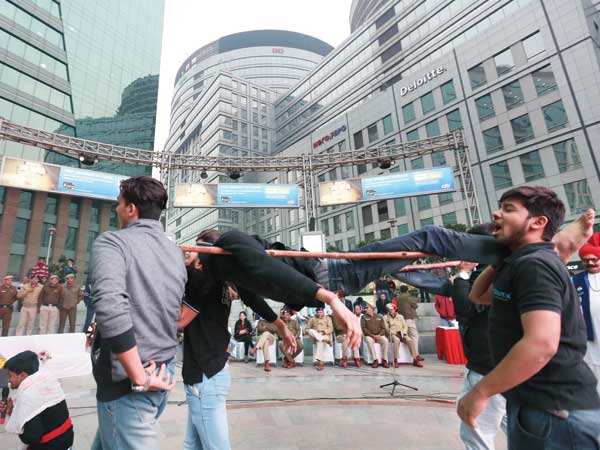 Students of Amity University, Gurgaon, perform a play on road safety in Cyber Hub 